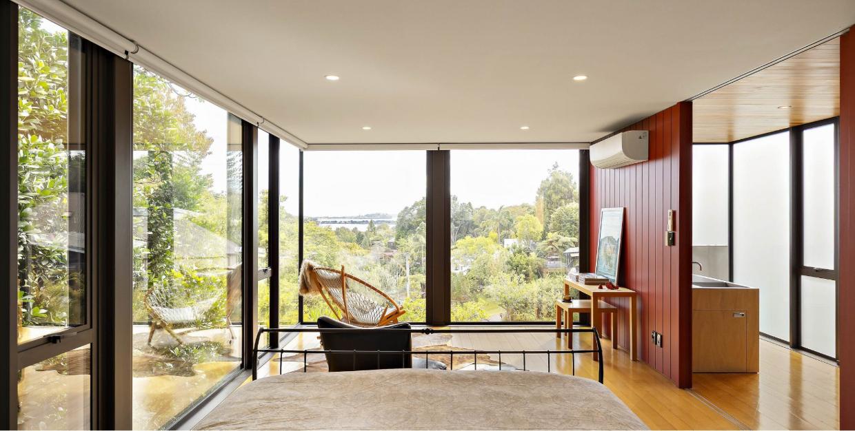 Master bedroom windows display a view across to Devonport. 