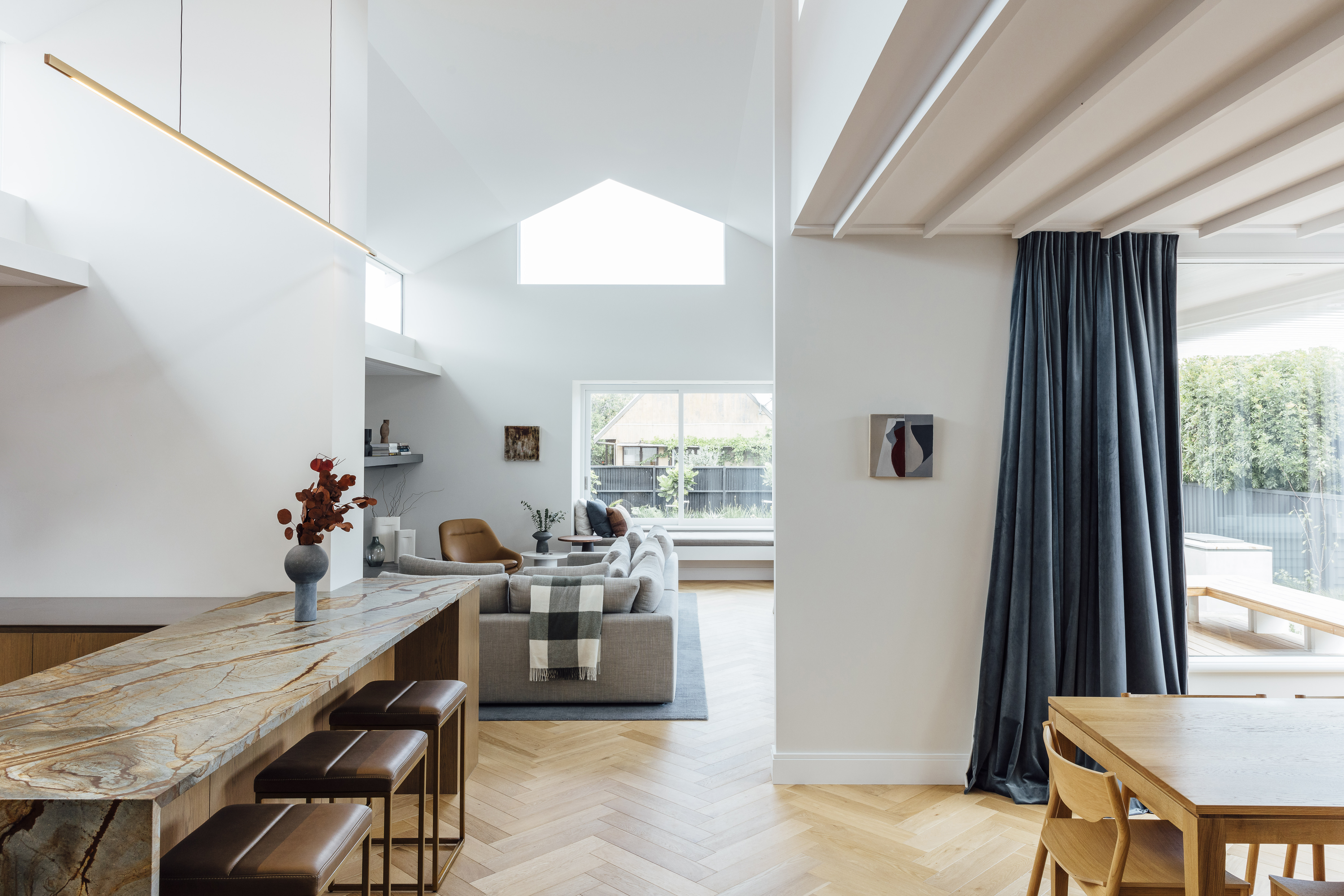 Initially, the couple thought they’d make a bold statement with paint, but on Karen’s advice, they opted for more neutral choices, including Dulux Haast Half on the walls in the living spaces and Dulux Ōkārito for the ceiling, trims and doors. The triangular window to the south accentuates the gable nature of the home, and the family has discovered that from the outside looking in at night, it looks sculptural, like a star. ‘You’re welcome, neighbours,’ jokes James.”
