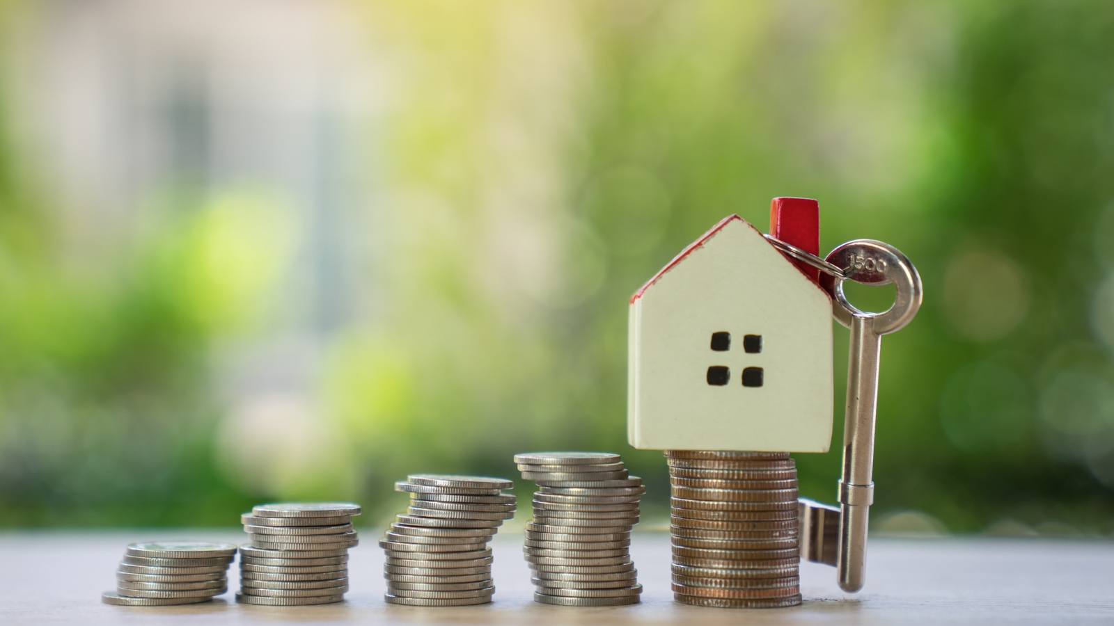 Coins stacked with house. 