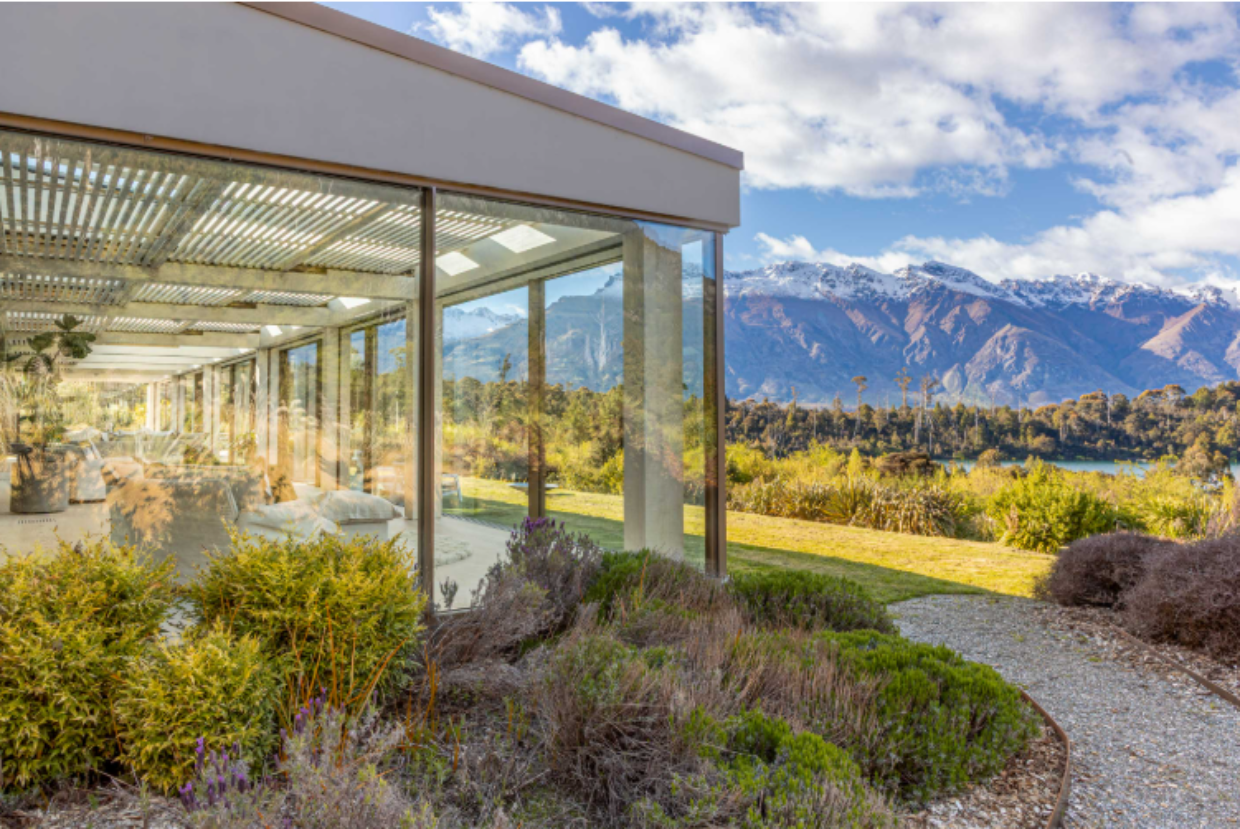 A 30m-long conservatory with overhead louvres is a key feature of the triple-glazed house. 