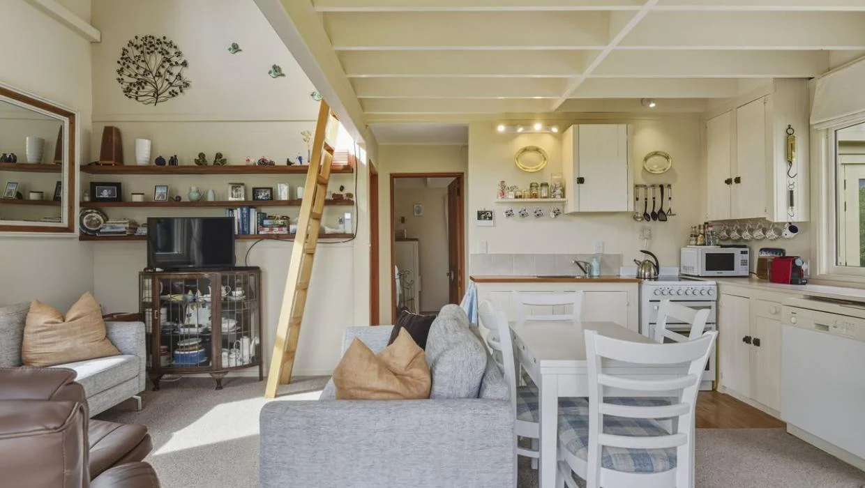 A mezzanine floor reached by a ladder provides an additional sleeping space.