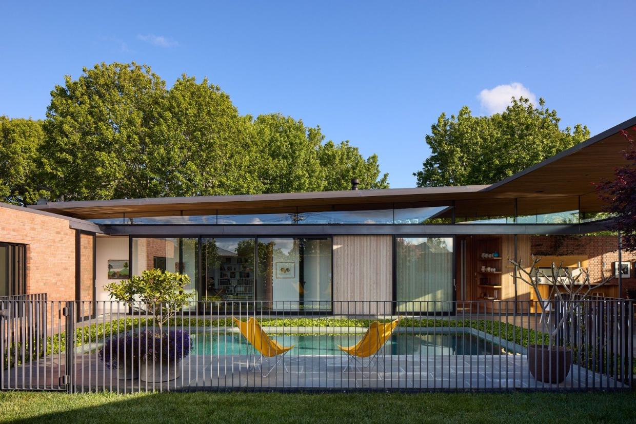 The home wraps around the site, and pushes into a tricky corner, maximizing space left for the courtyard. 