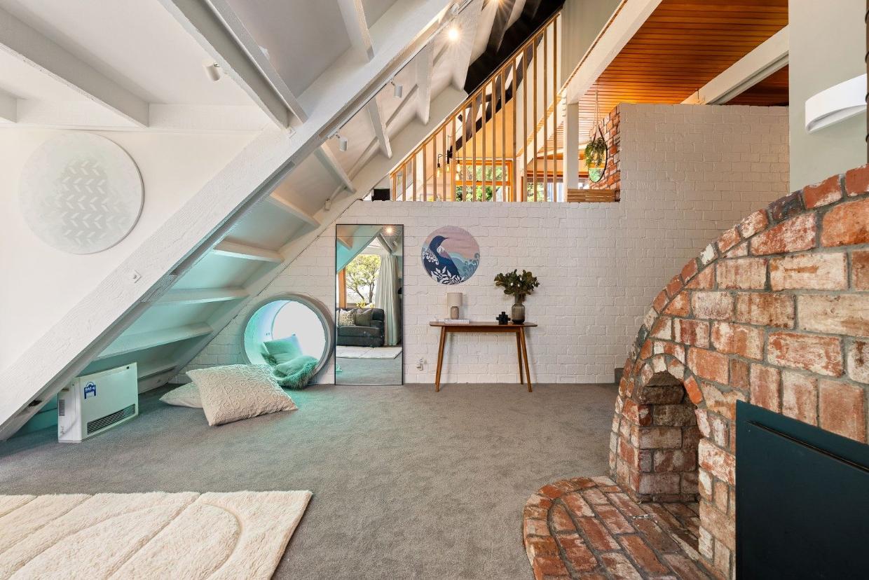 The main living room with the tunnel through to the pool. 