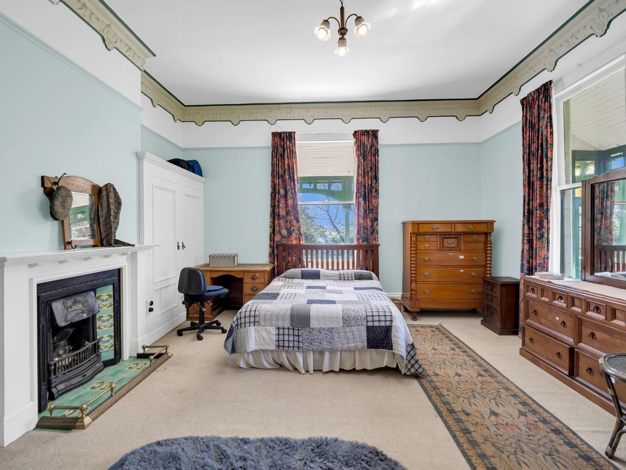 One of the five bedrooms in the house shown