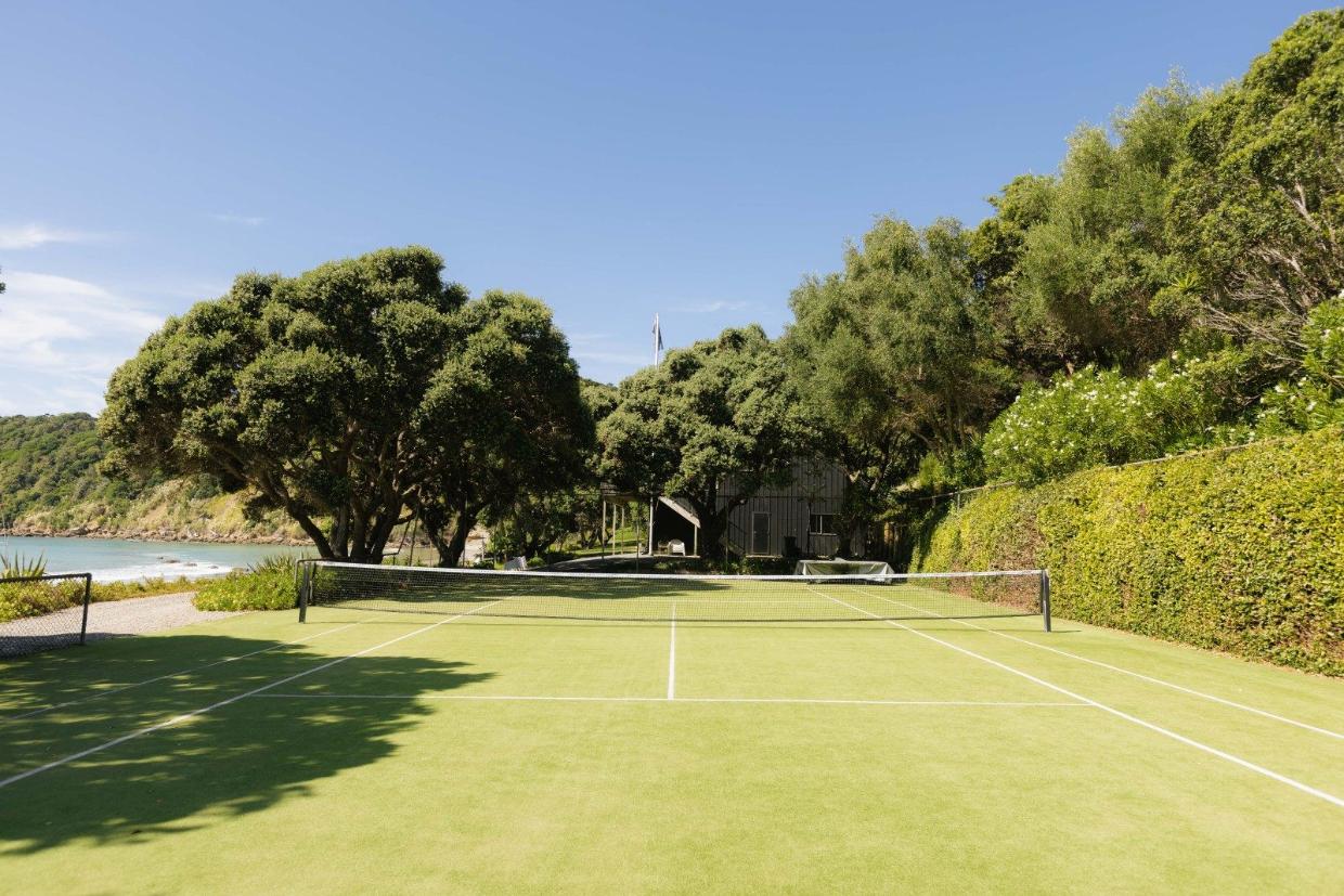 A tennis court included. 