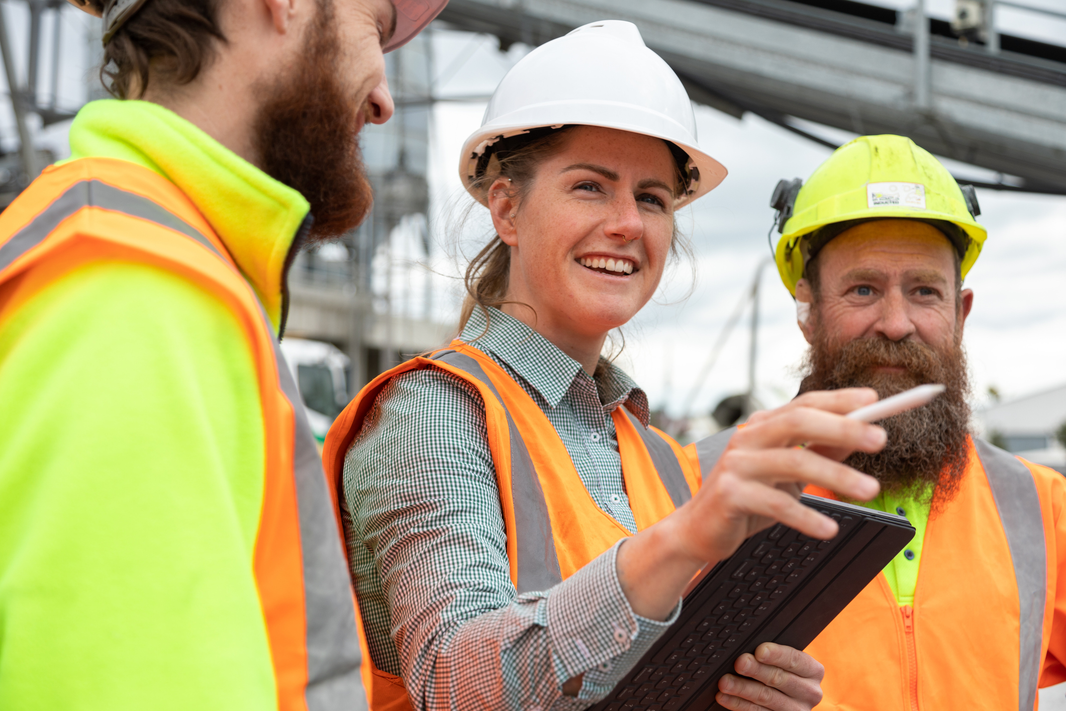 Woman delegating tasks on a building site.