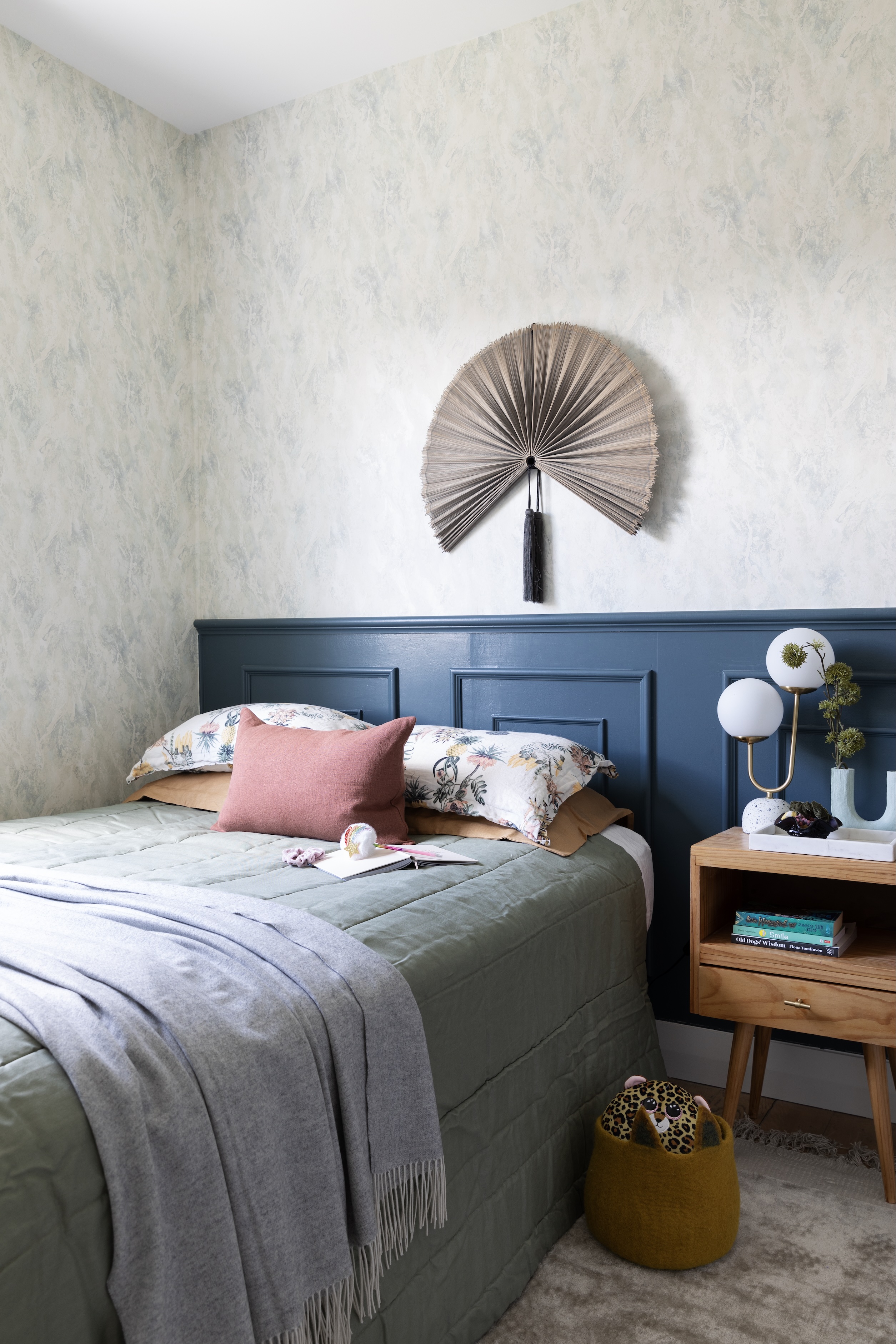 In Gwynnie’s bedroom, the hero statement is this wallpaper from Resene’s French Impressionist collection, teamed with a fan from BoConcept and wall panels in Resene Atomic.