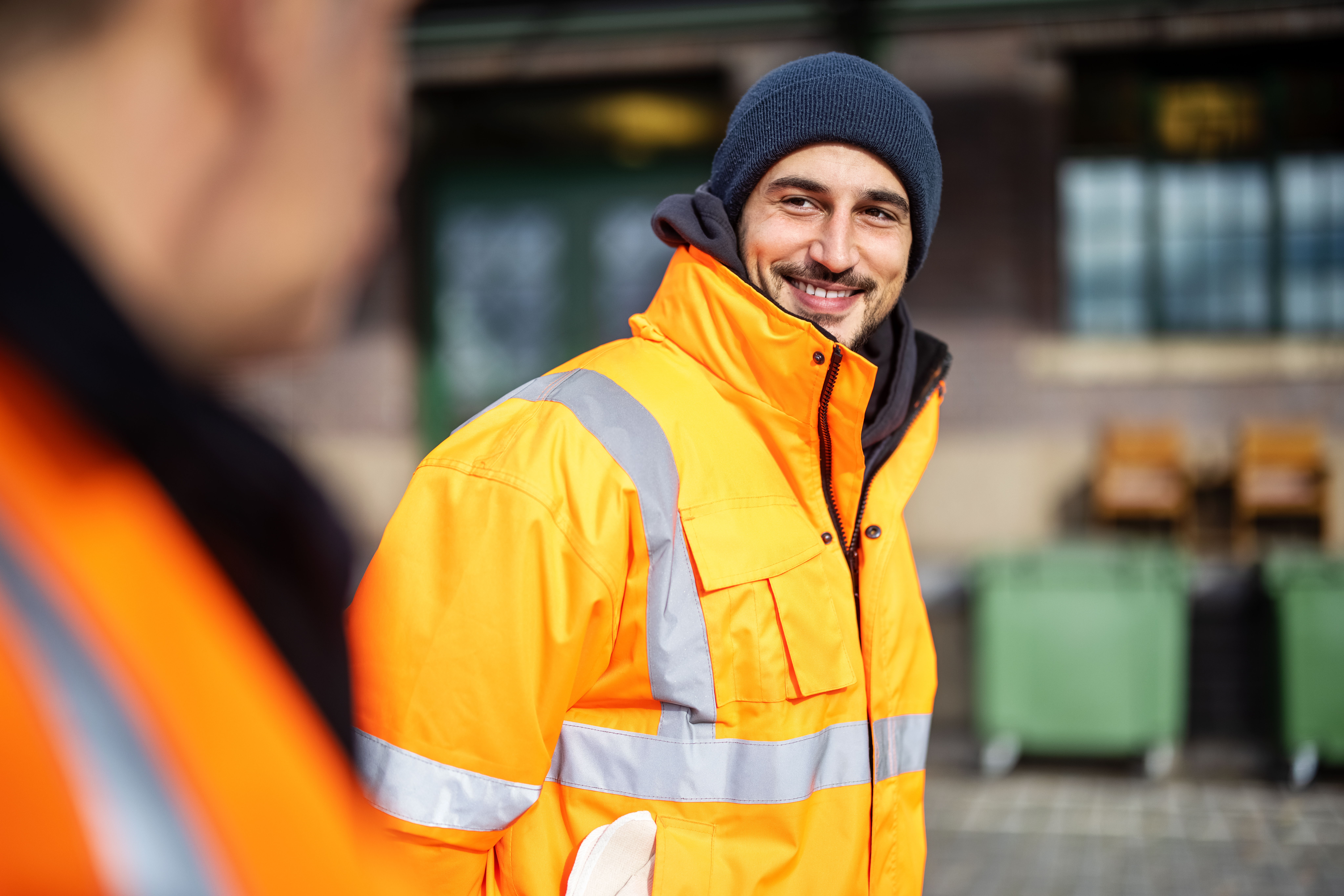 Male tradie outside in work uniform.