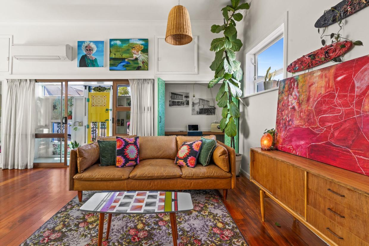 A transition area leads from the bright yellow front door into the living quarters, which reflect the owner’s vibrant personality.