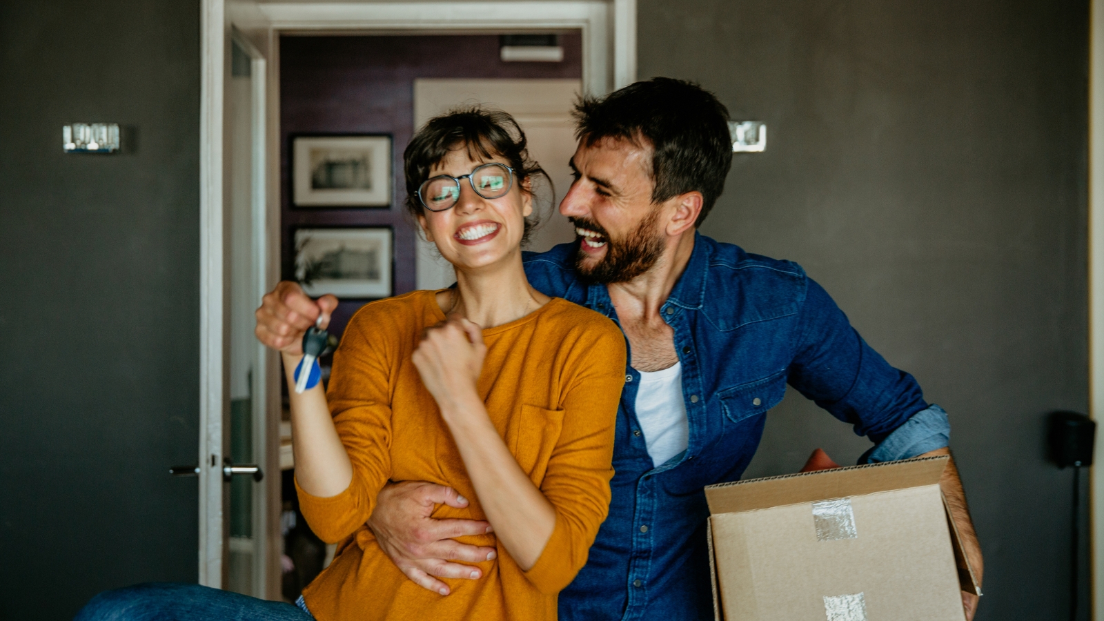 Couple excitied about moving into home. 