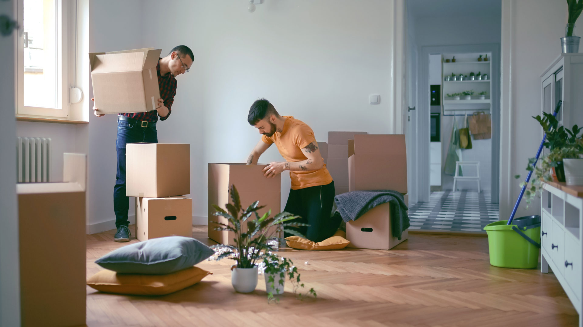 Couple unpacking their boxes in the new home they have just bought.