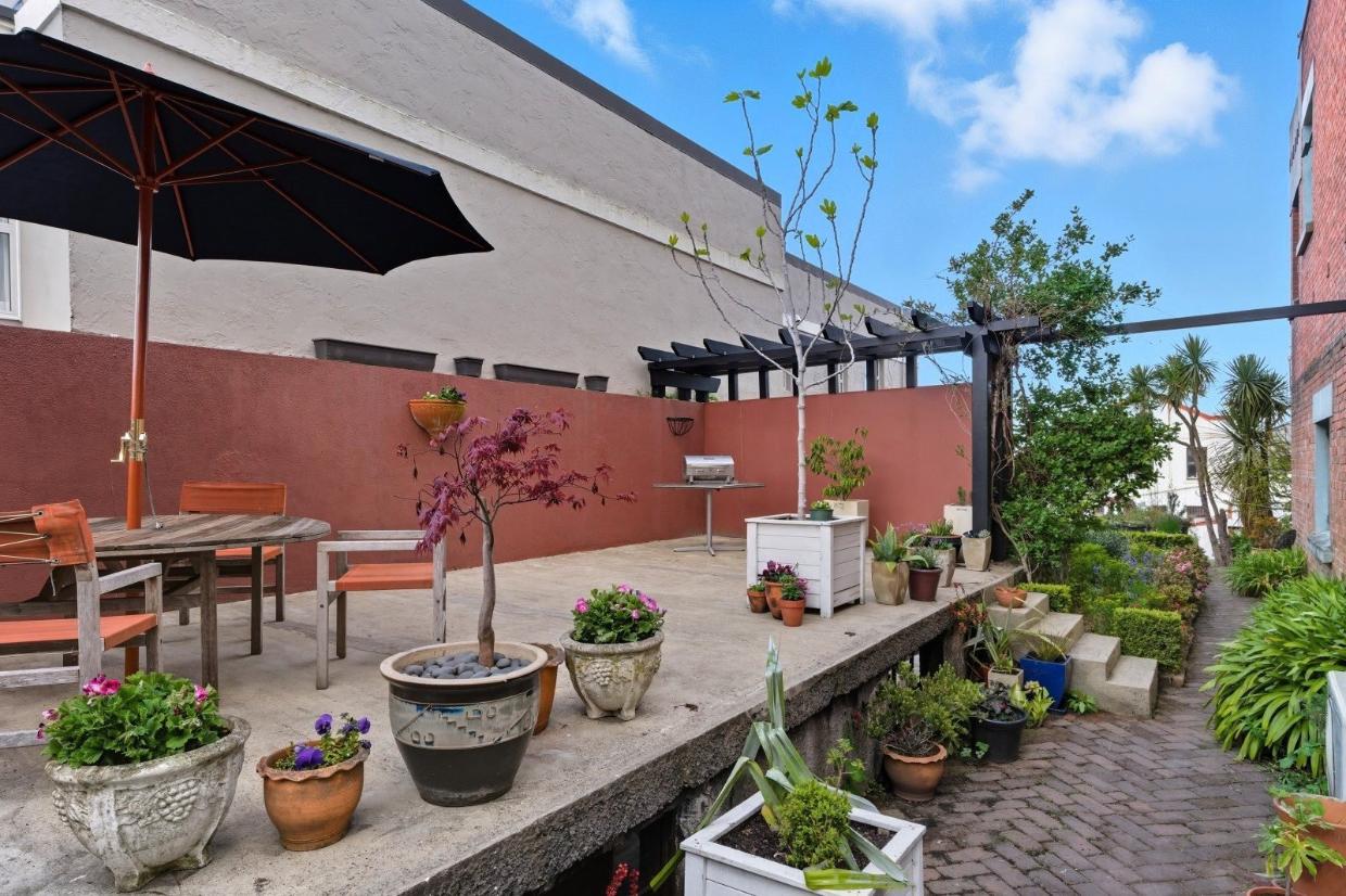 The concrete roof of the single garage provides the perfect place for a shared outdoor living area - there is additional parking at the rear of the property.