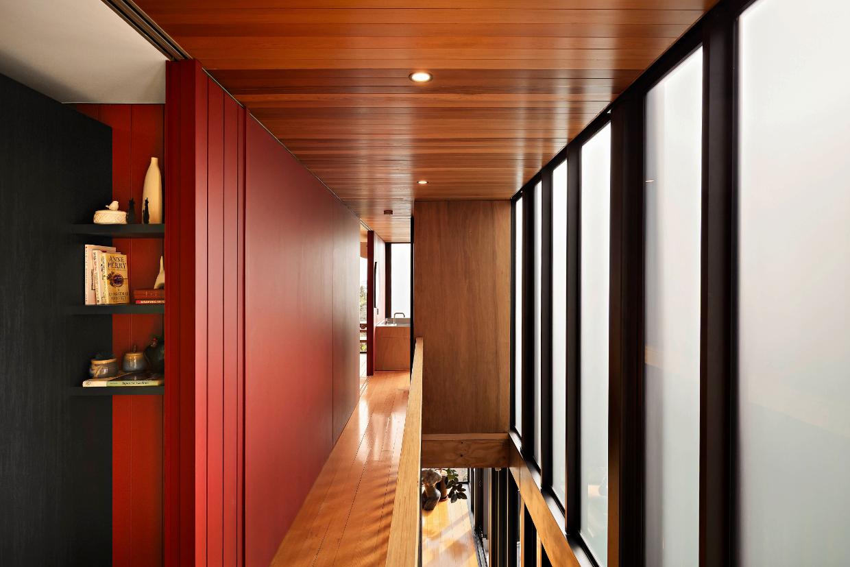 The house has timber floors and red walls. 