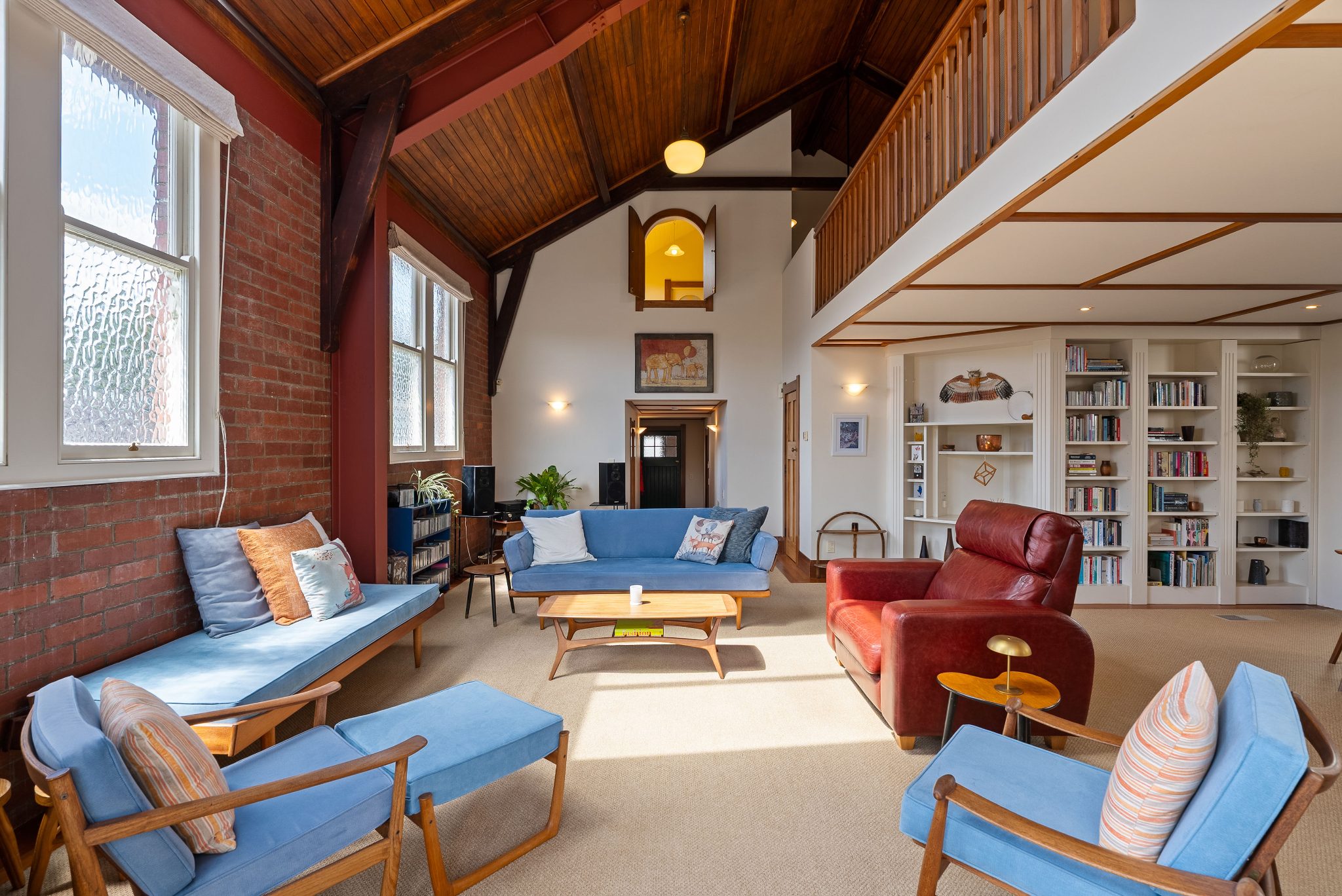 The space has high ceilings and a Juliet balcony.