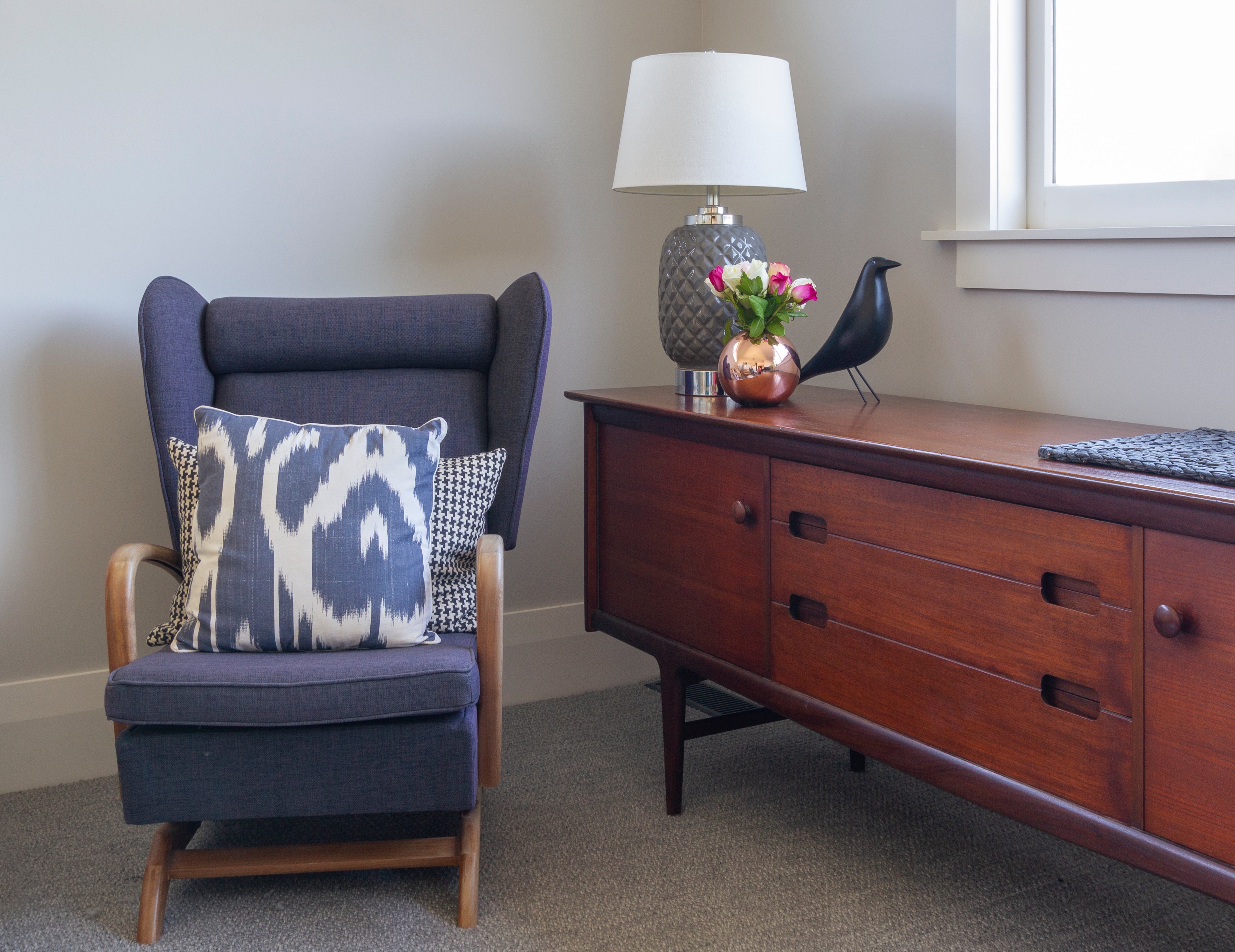 Old meets new, styled chair next to side board