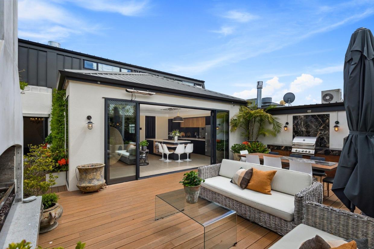 There is an expansive outdoor roof terrace all set for alfresco dining with fireplace and barbecue facilities. 
