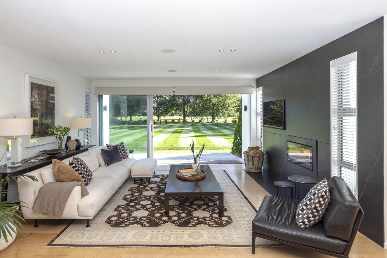 Large windows showing the lawn view.