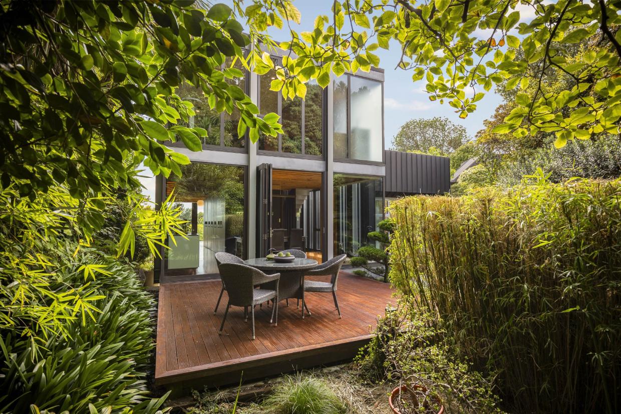 Floating deck is revealed surrounded by the nature and private backyard. 