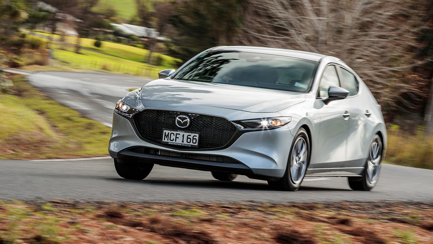 Grey Mazda 3 action front shot