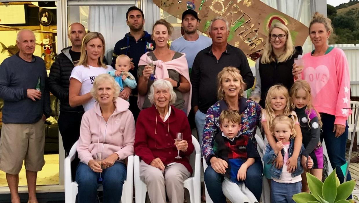 The clan gathered at the bach in 2019 for “Ga’s” (Kath Walters’) 94th birthday celebrations. Jan Walters is seated front right, with her grandson on her knee. Photo: Supplied