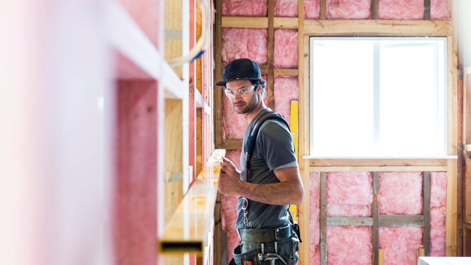 Guy building house