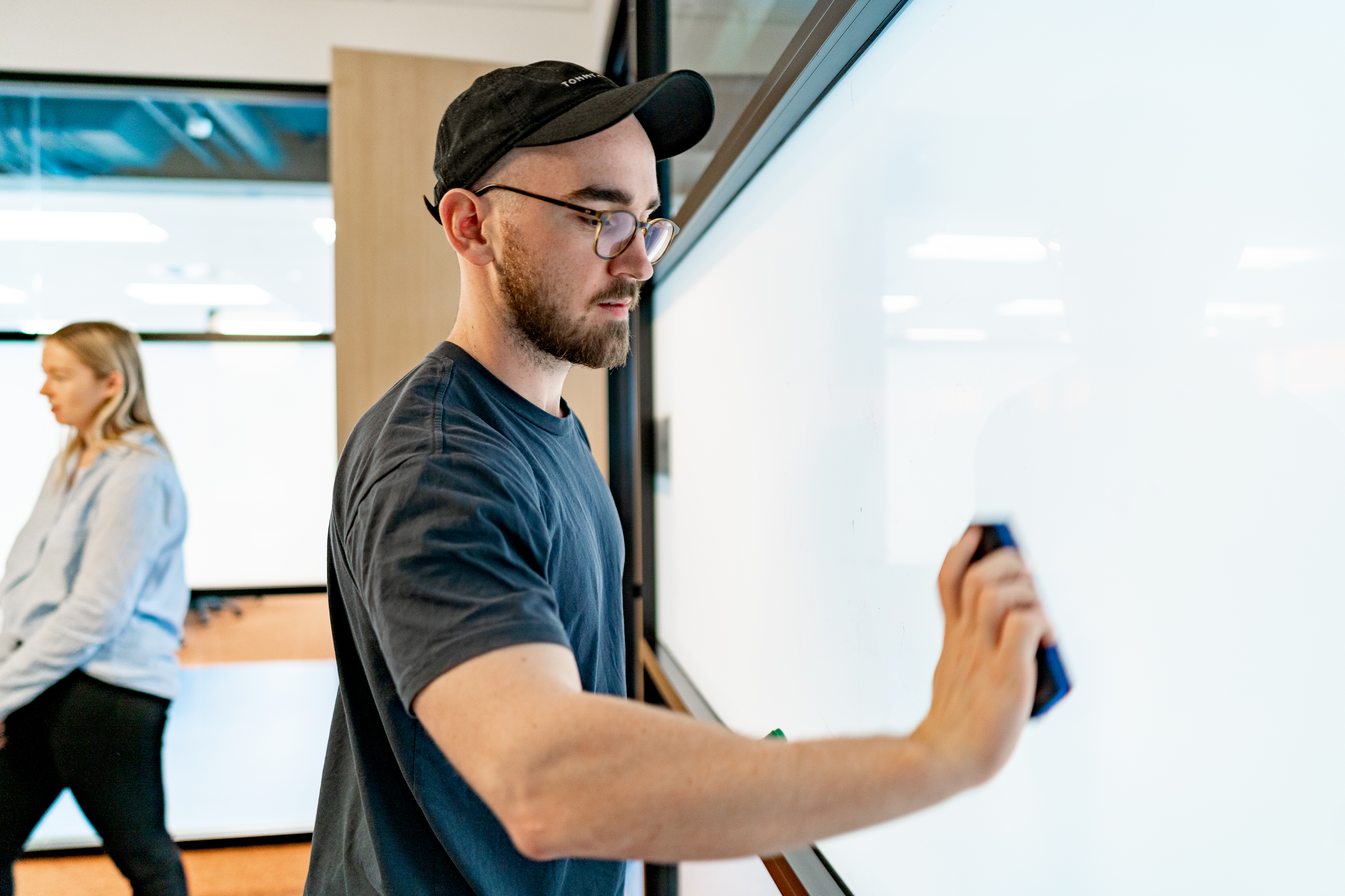 Professional brainstorming on a whiteboard.