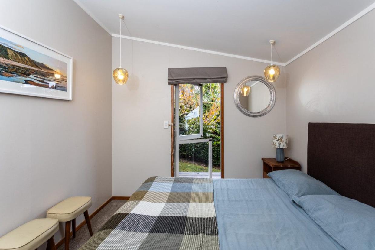 Bedroom doors opening out into the garden and radiating sunlight throughout the day. 