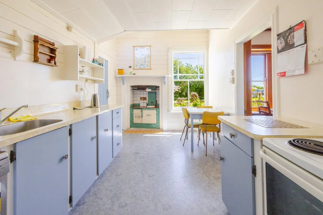 The layout includes a formal parlour, combined family living and dining area, separate kitchen, and main bathroom.