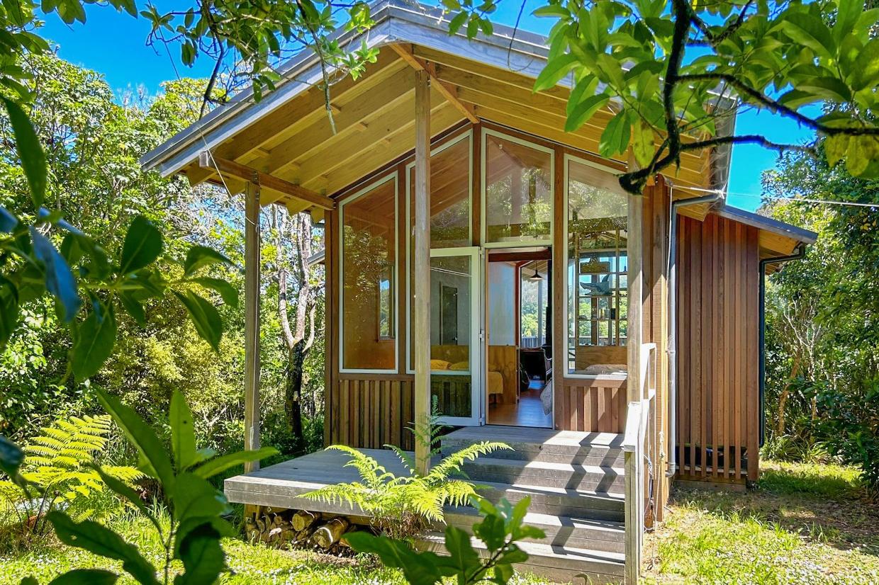 The cabin is glazed at both ends - at the rear it opens out to an area of flat lawn. 
