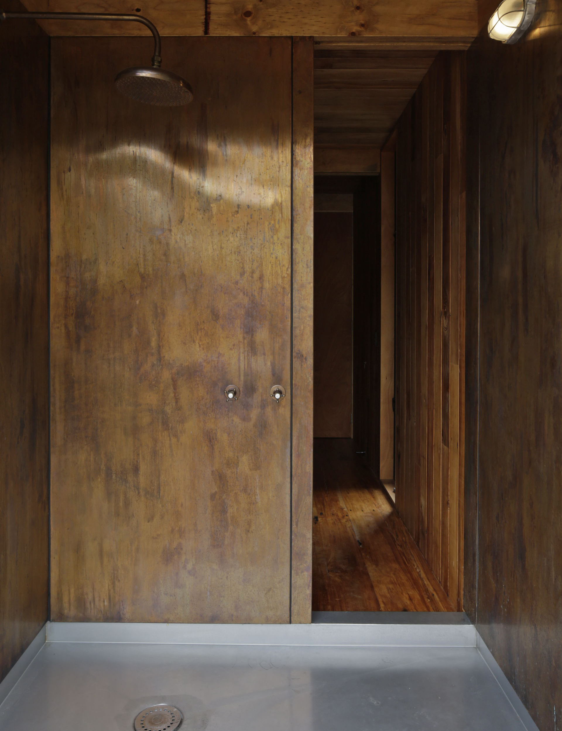 Rustic shower surrounded by natural wood