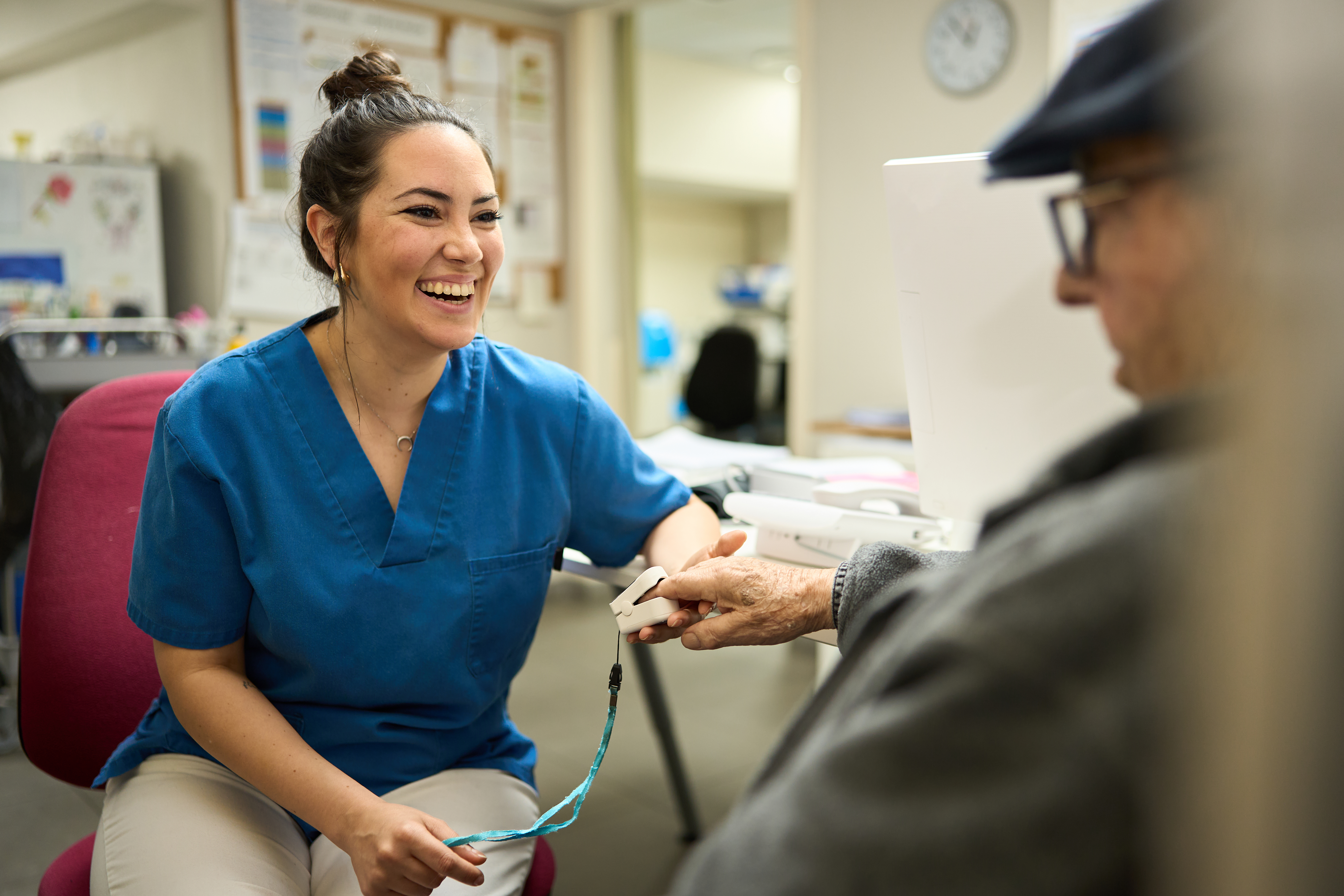Female nurse helping an elderly patient