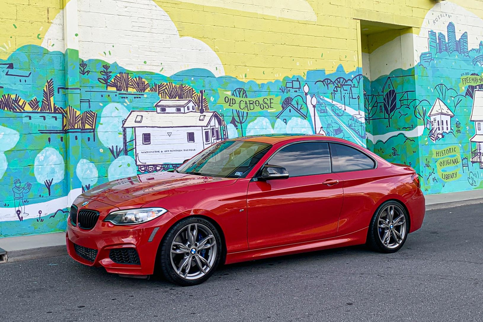 Red BMW M235i side view