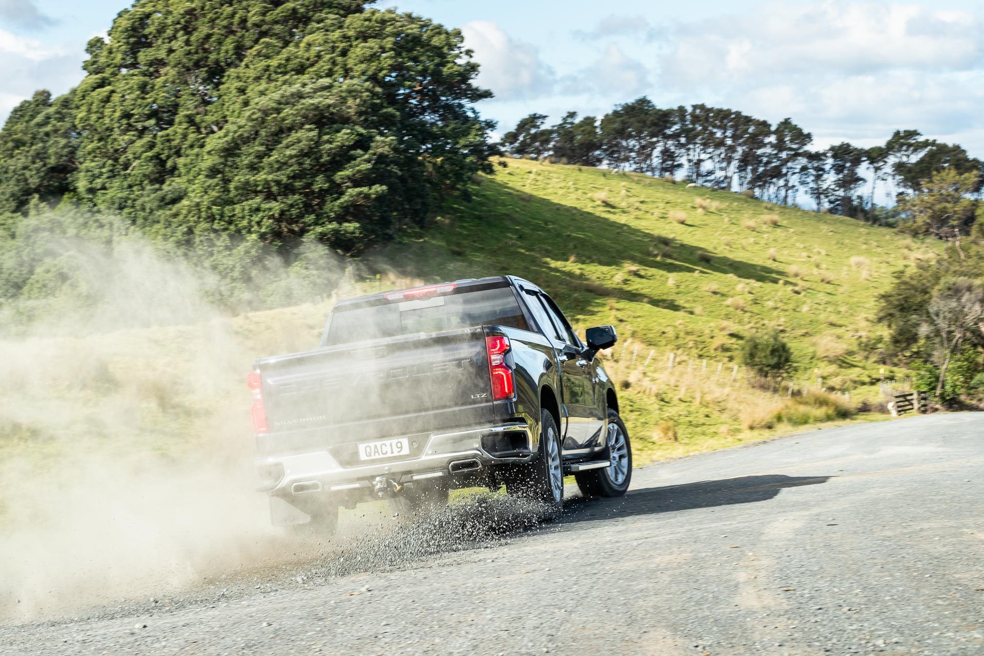 2023 Chevrolet Silverado 2500 LTZ Z71 driving rear shot