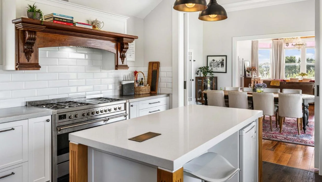 The rangehood mantle in the kitchen was restored to its former glory.