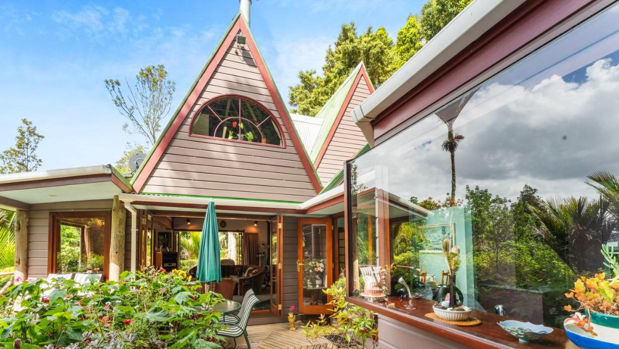 This home has been thoughtfully added on to, creating a family retreat. Pitcured from outside.