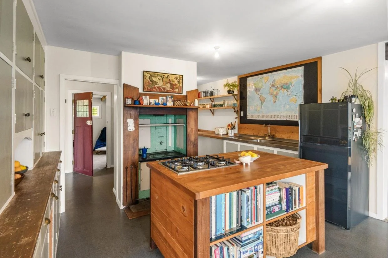 The home is packed with vintage features, such as this coal range, which heats the water in winter.