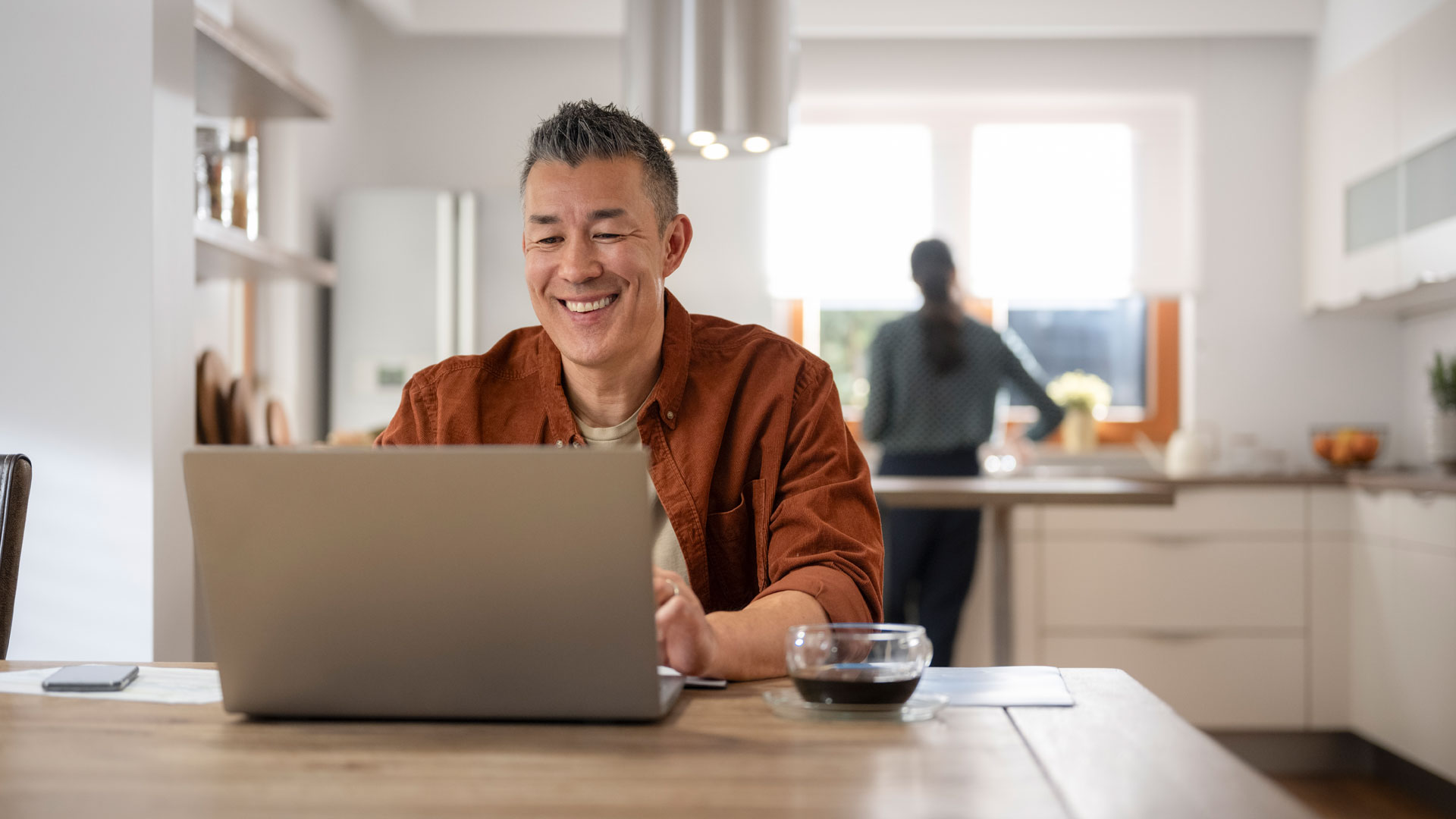 Landlord reading about their responsibilities on a laptop at home.