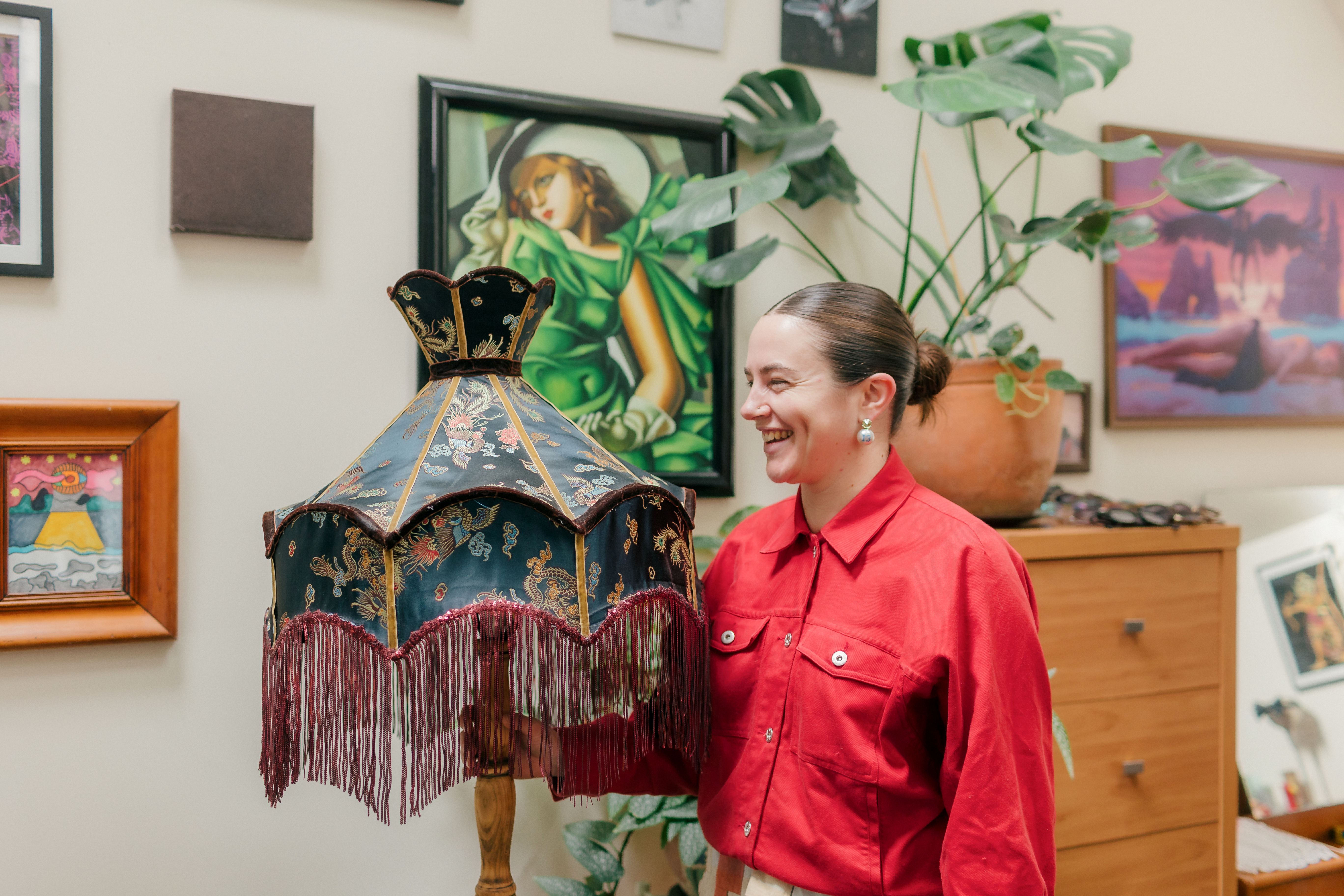 Hana holds the thai silk lampshade she made