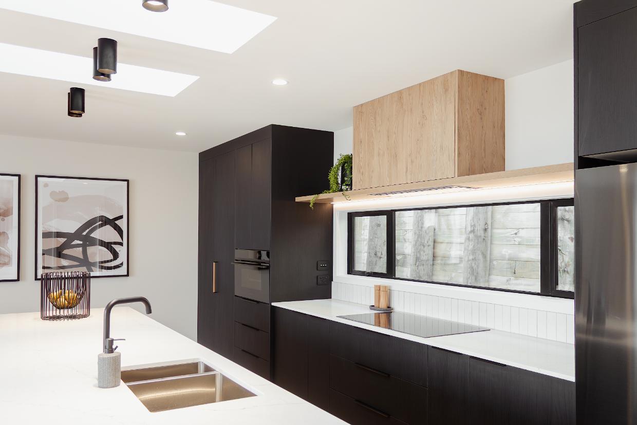 Black and oak combination in the kitchen design. 