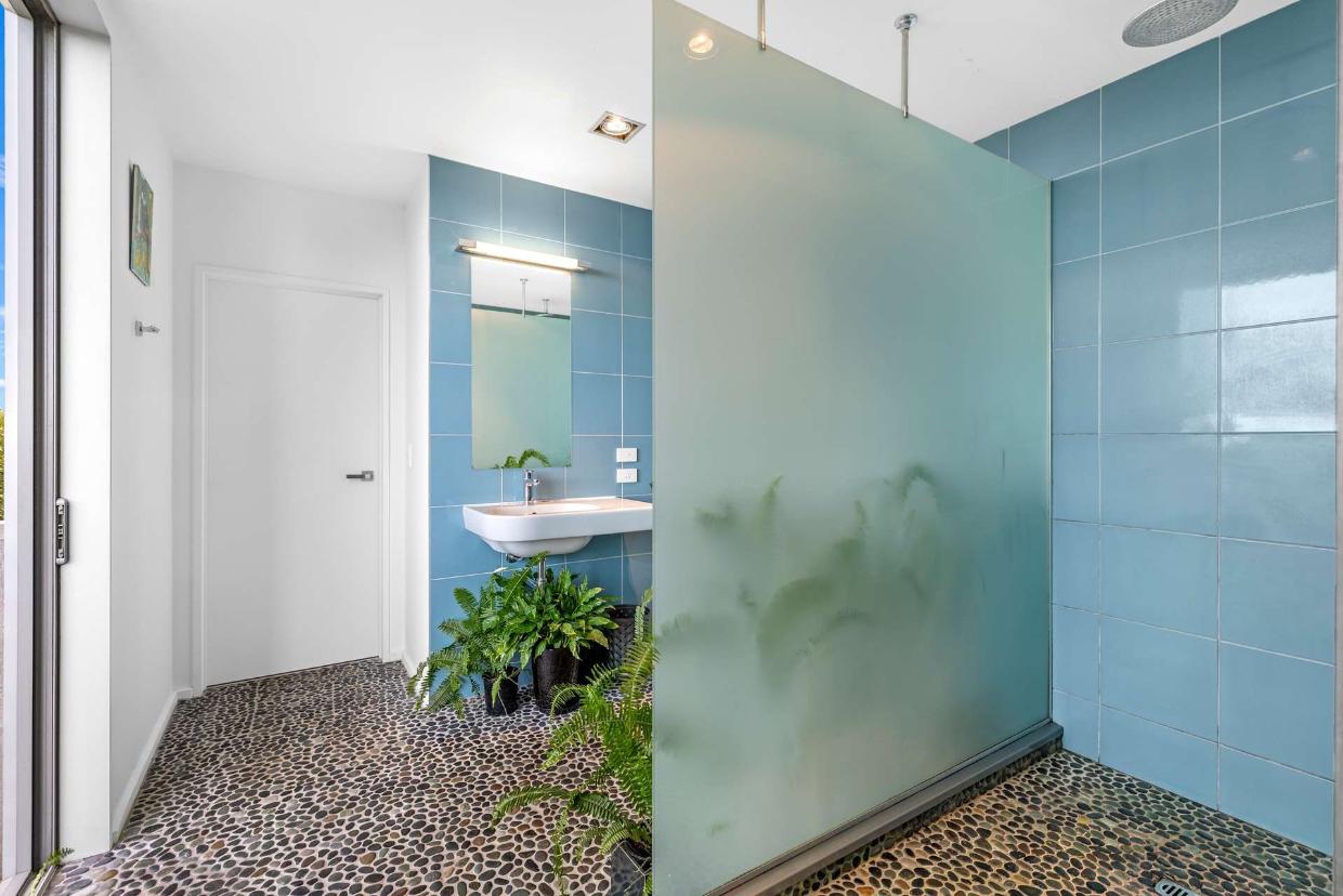 The walk-in shower next to the bedroom. 
