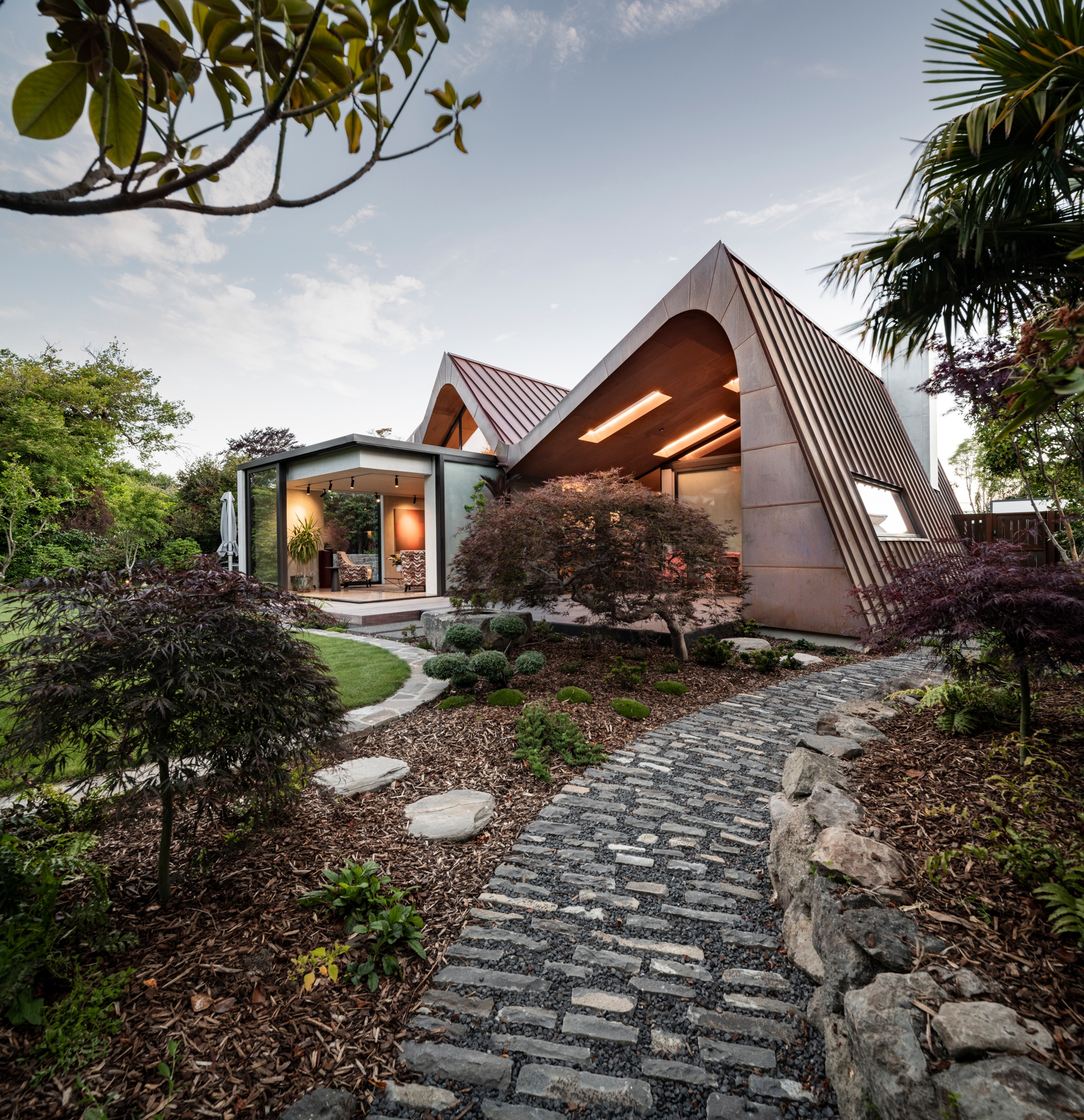 City Home of the Year 2021 finalist, Concrete Copper House by Smith Architects, enjoys a beautiful position beside the Waimairi Stream, a thin tributary of the Avon River. 