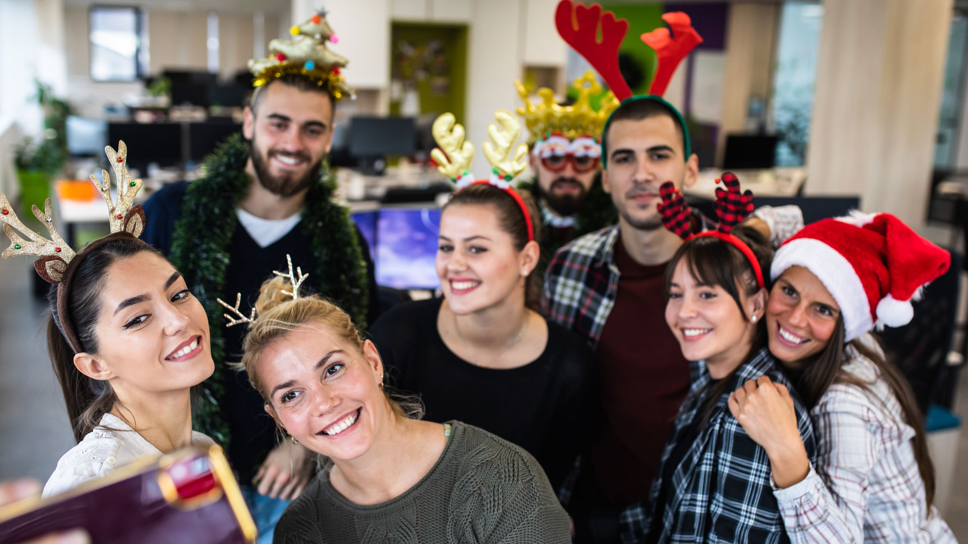 Colleagues at a Christmas party together.