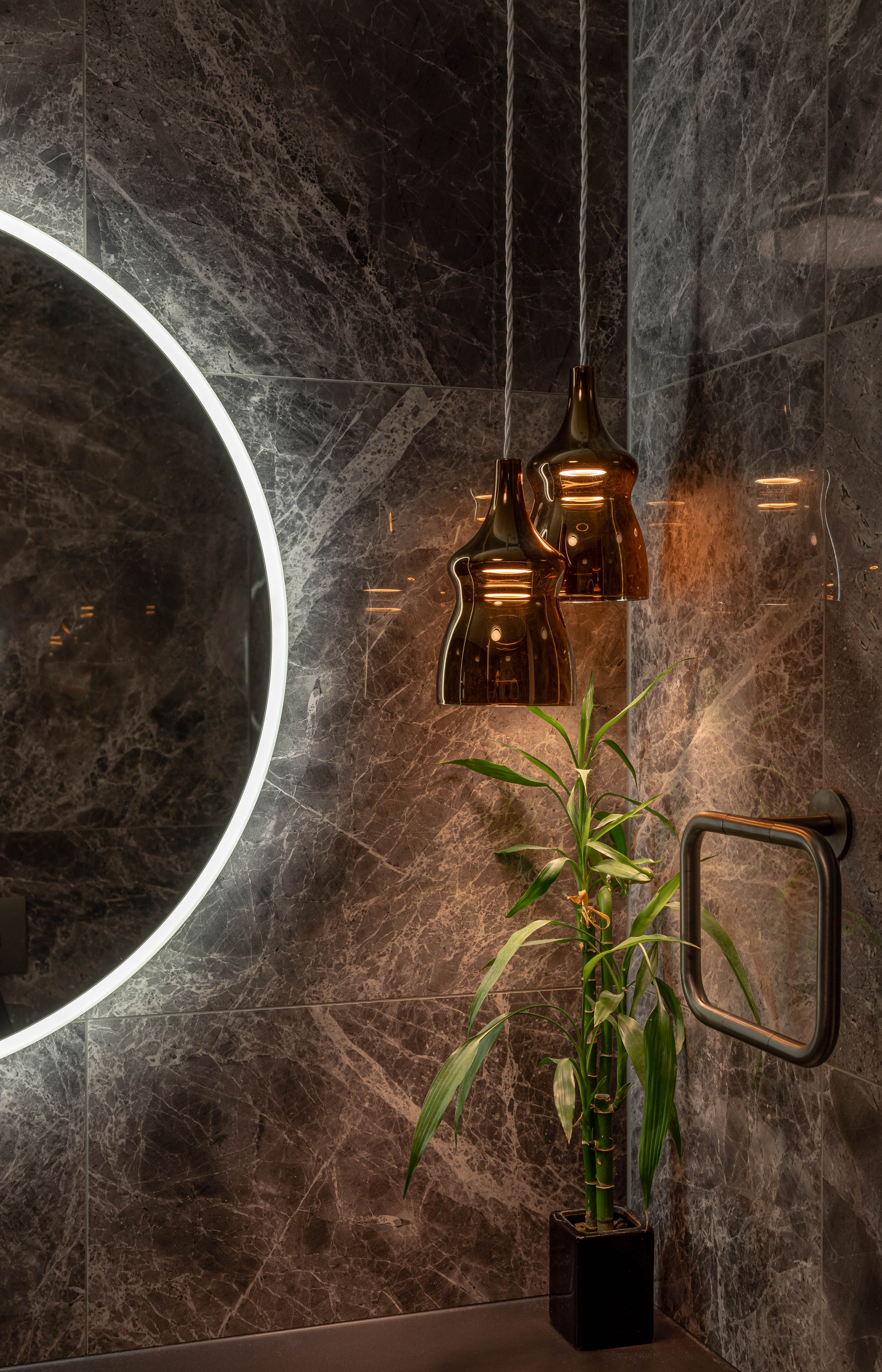 This lighting plan for a Remuera bathroom designed by Yellowfox creates a decidedly moody, ambient space. Image: John Williams