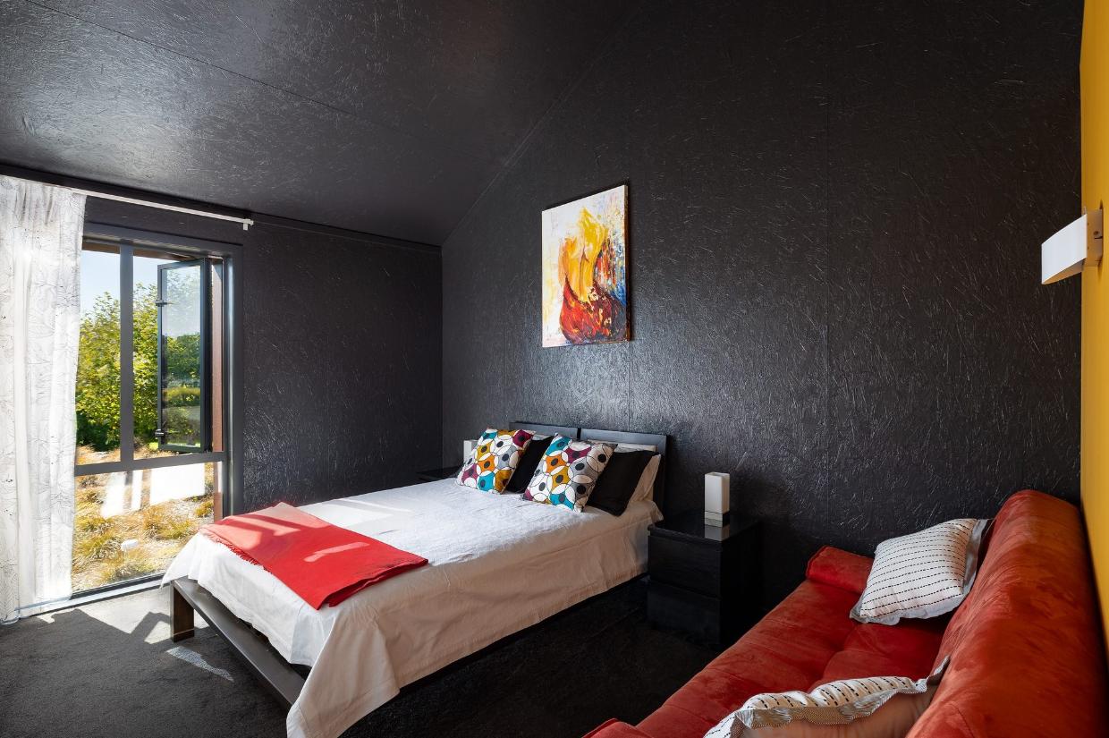 The black walls and ceilings were considered somewhat controversial back in 2017, but have proved to be the perfect backdrop to both the view and the owners’ art collection.