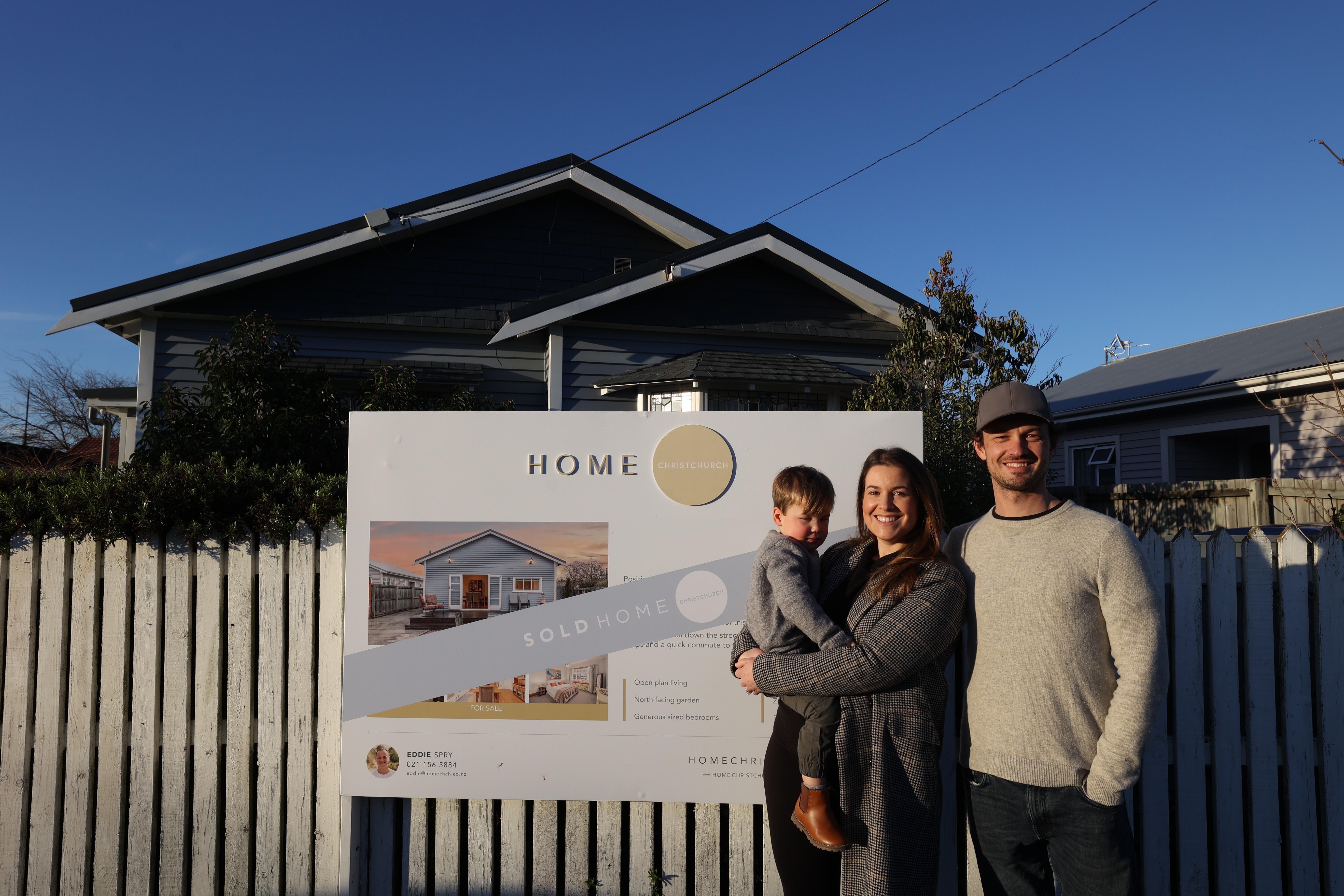 First home buyers Rebecca Stewart and Josh Fuller with their son outside their new home in Christchurch, purchased for $640,000.