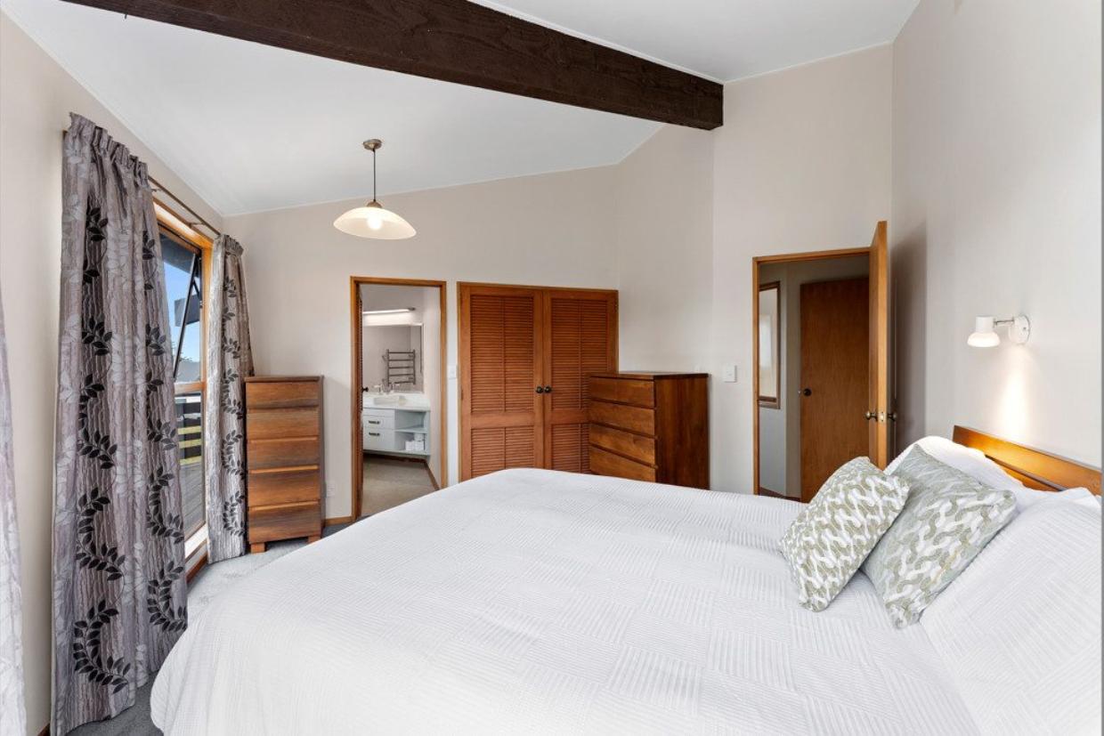 One of the three bedrooms in the house shown. 