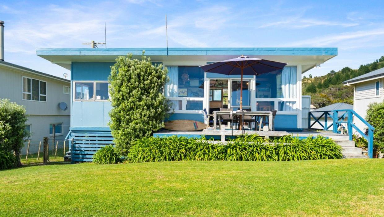 It’s as cute as - this Teal Bay bach in Northland has served the Walters family well for 70 years, but they’re ready to pass it on. Photo: Bayleys