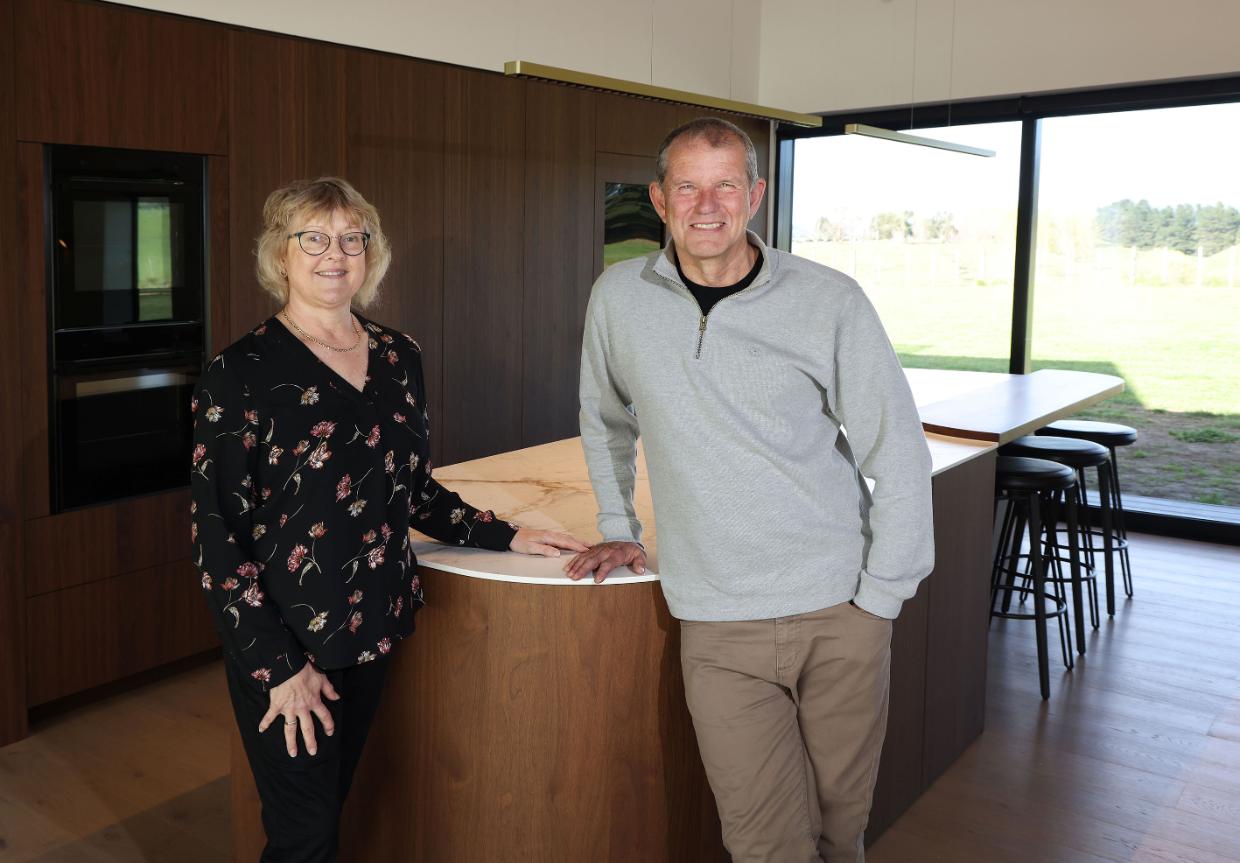 Owners standing by the transformed benchtop