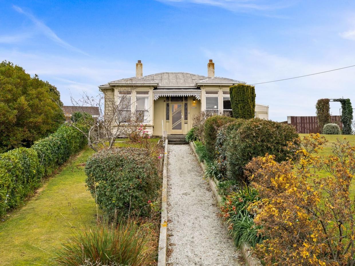 With its long central path and traditional early Edwardian architecture, the property retains its formal symmetry. Photo: BE Real Estate