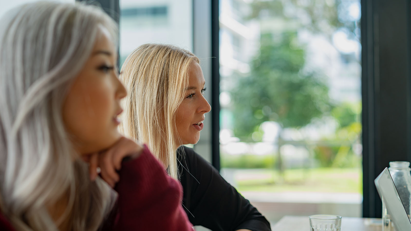 Two women interview a potential candidate.